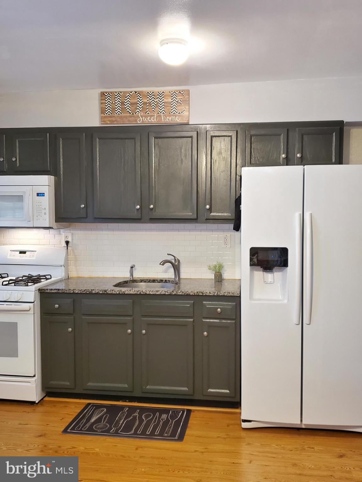1905 Stanhope Road Baltimore, MD 21222 - Photo 2 of 16 a kitchen with stainless steel appliances granite countertop a refrigerator and a sink