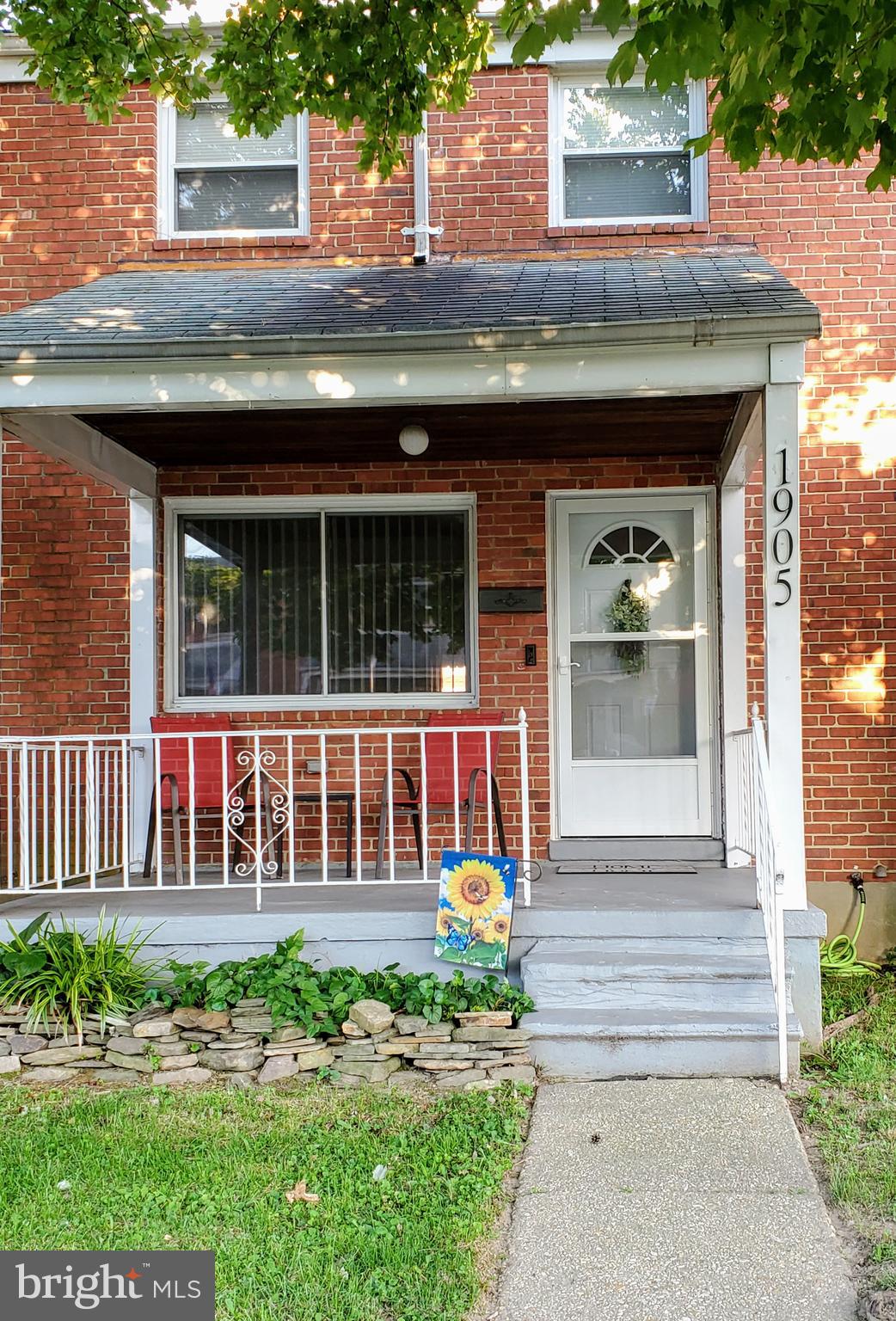 1905 Stanhope Road Baltimore, MD 21222 - Photo 14 of 16 a front view of a house with a garden