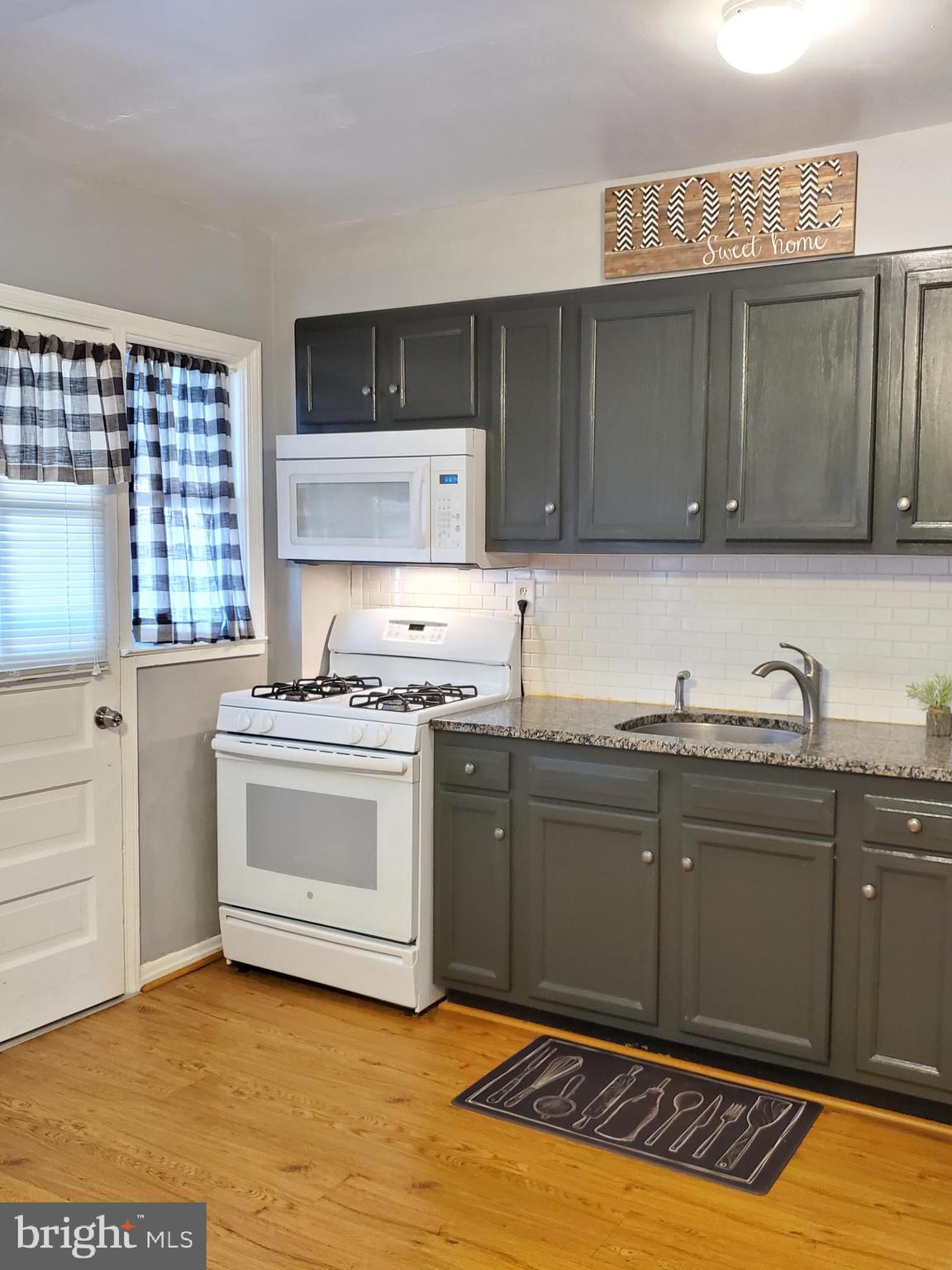 1905 Stanhope Road Baltimore, MD 21222 - Photo 3 of 16 a kitchen with a sink and cabinets