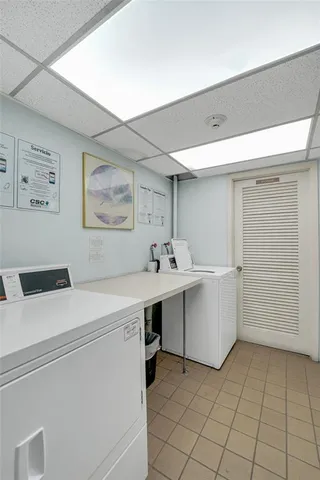 a view of cabinets with racks on the wall