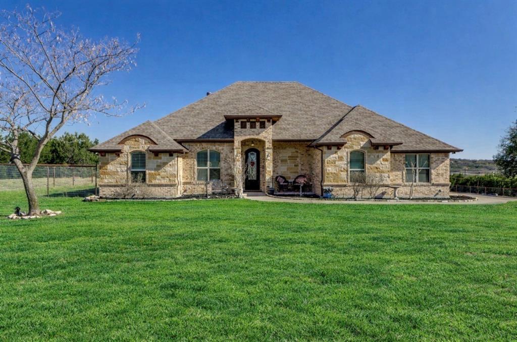 259 Hidden Creek Road Cresson, TX 76035 - Photo 1 of 28 French provincial home featuring stone siding, brick siding, and a shingled roof