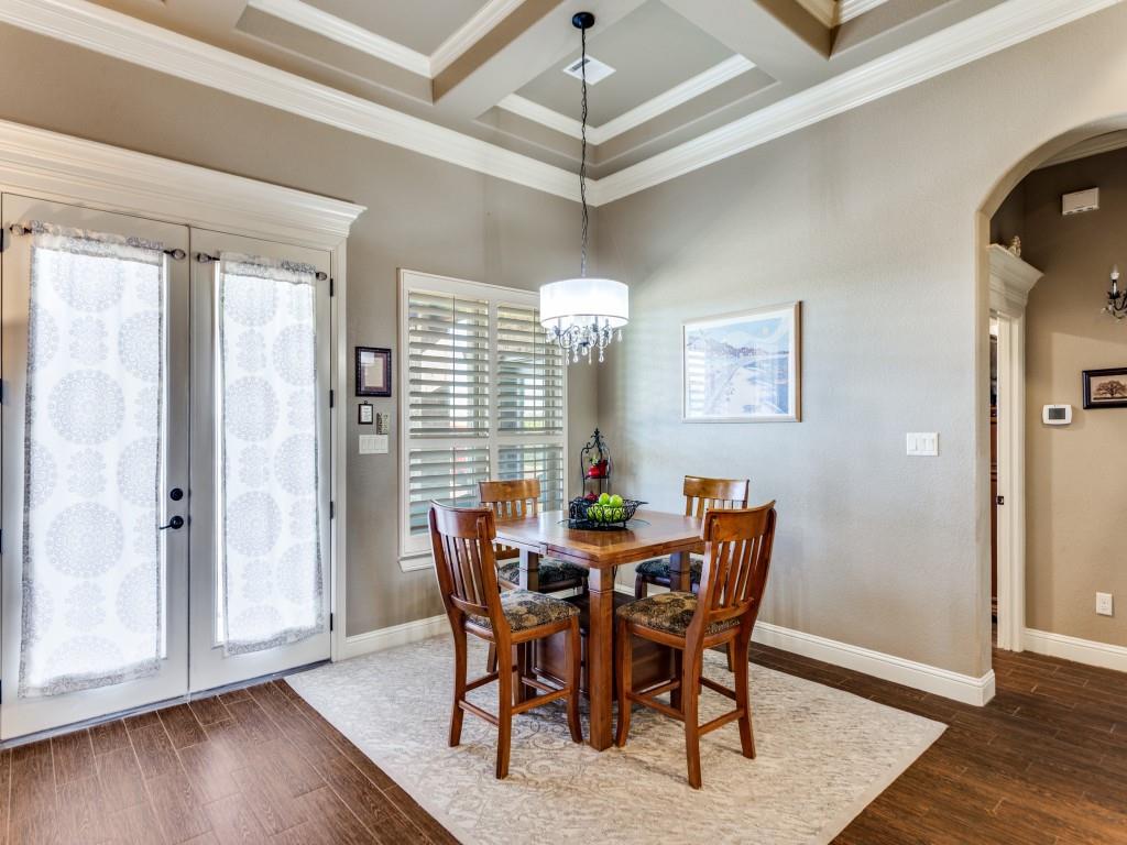 259 Hidden Creek Road Cresson, TX 76035 - Photo 11 of 28 Dining space with coffered ceiling, arched walkways, dark wood-type flooring, french doors, and crown molding