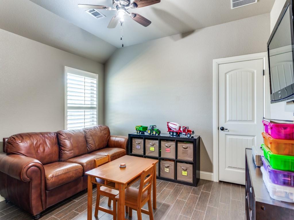 259 Hidden Creek Road Cresson, TX 76035 - Photo 12 of 28 Living room featuring a ceiling fan, wood tiled floors, and lofted ceiling