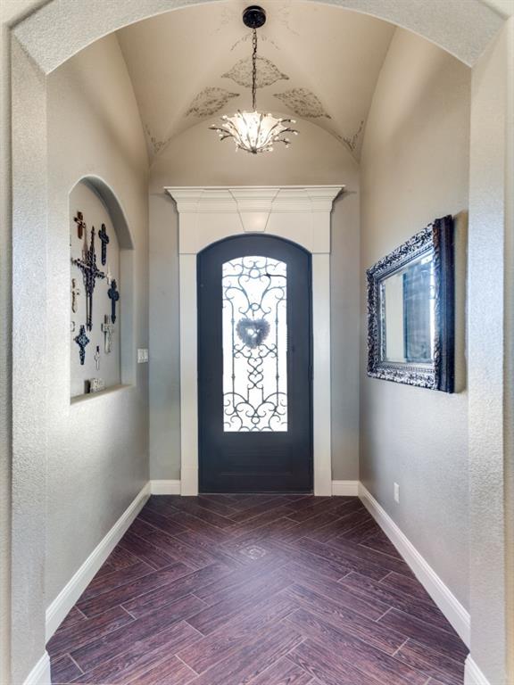 259 Hidden Creek Road Cresson, TX 76035 - Photo 3 of 28 Entryway with parquet flooring, a textured wall, and arched walkways
