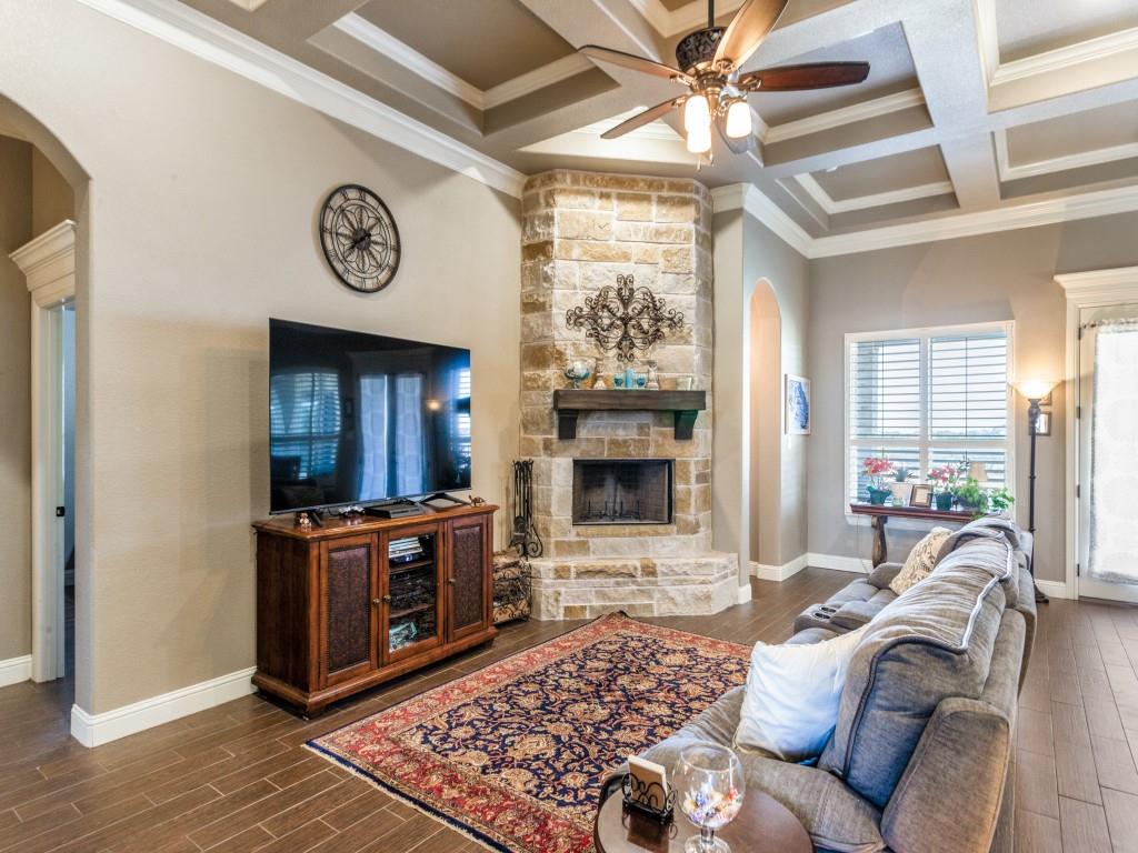 259 Hidden Creek Road Cresson, TX 76035 - Photo 4 of 28 Living area with arched walkways, coffered ceiling, wood tiled floors, and ornamental molding