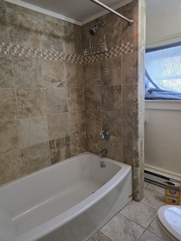 48 Maple Street, Unit 2 Holden, MA 01520 - Photo 8 of 11 a bathroom with a bathtub and a shower