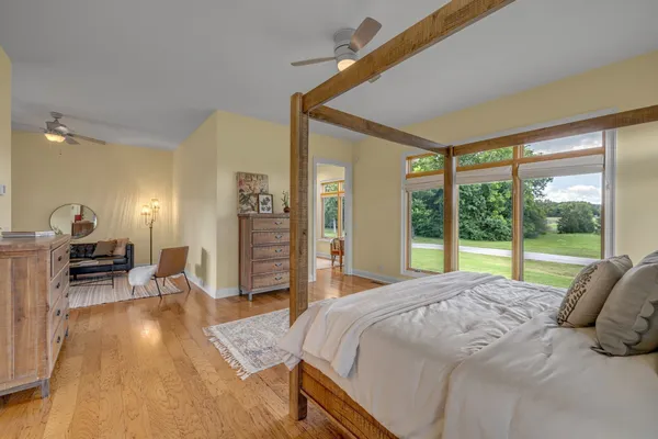 a living room with furniture a fireplace and a table