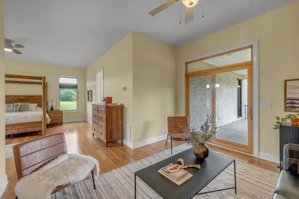 a spacious bathroom with a granite countertop sink and a mirror
