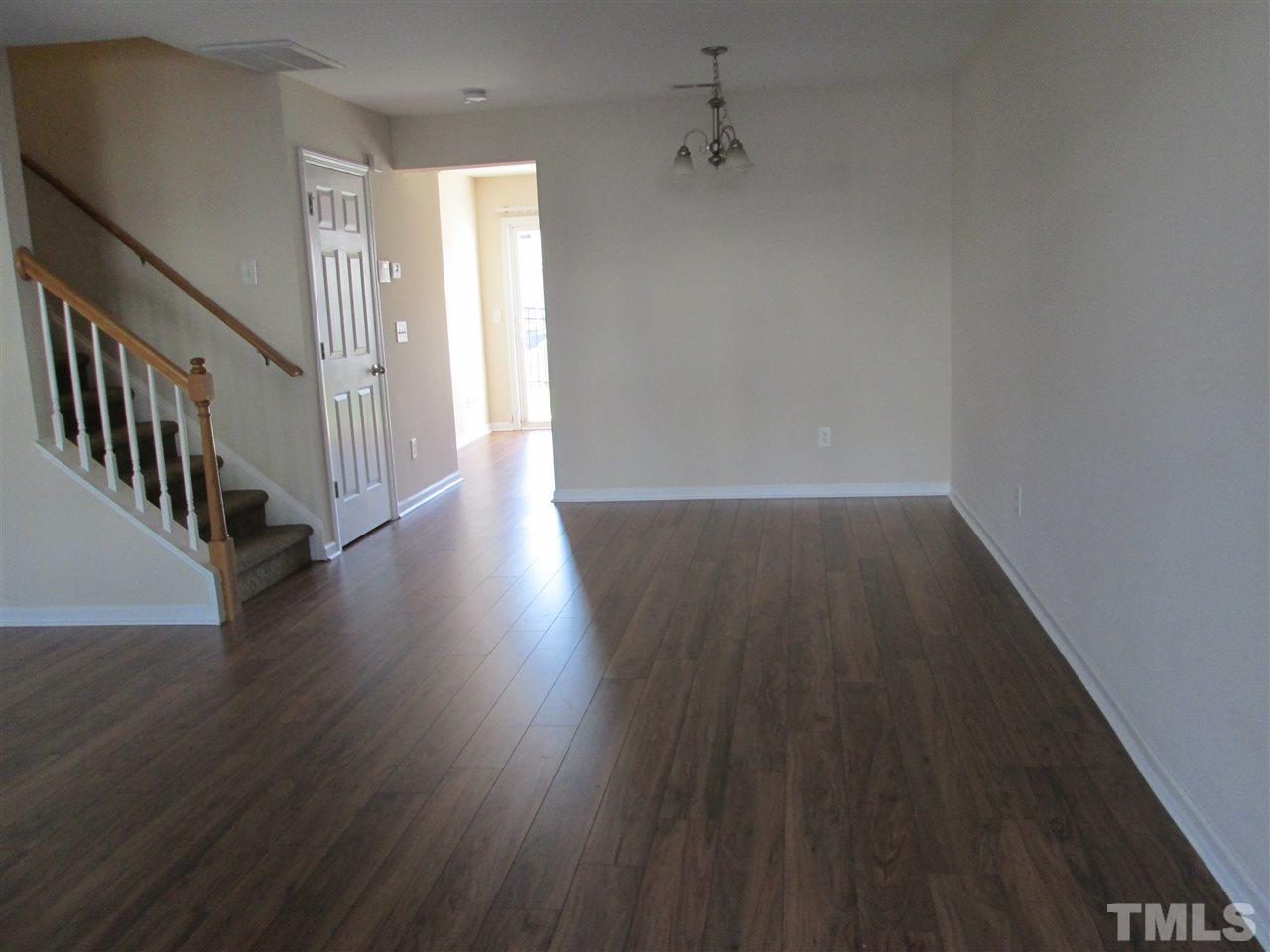 7706 River Field Drive Raleigh, NC 27616 - Photo 2 of 20 a view of a hallway with wooden floor