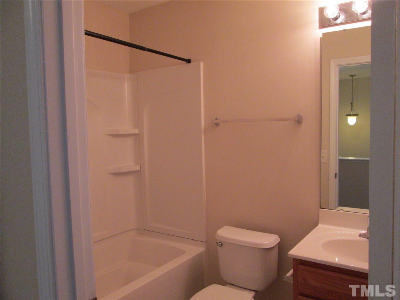 7706 River Field Drive Raleigh, NC 27616 - Photo 16 of 20 a bathroom with a toilet and a shower