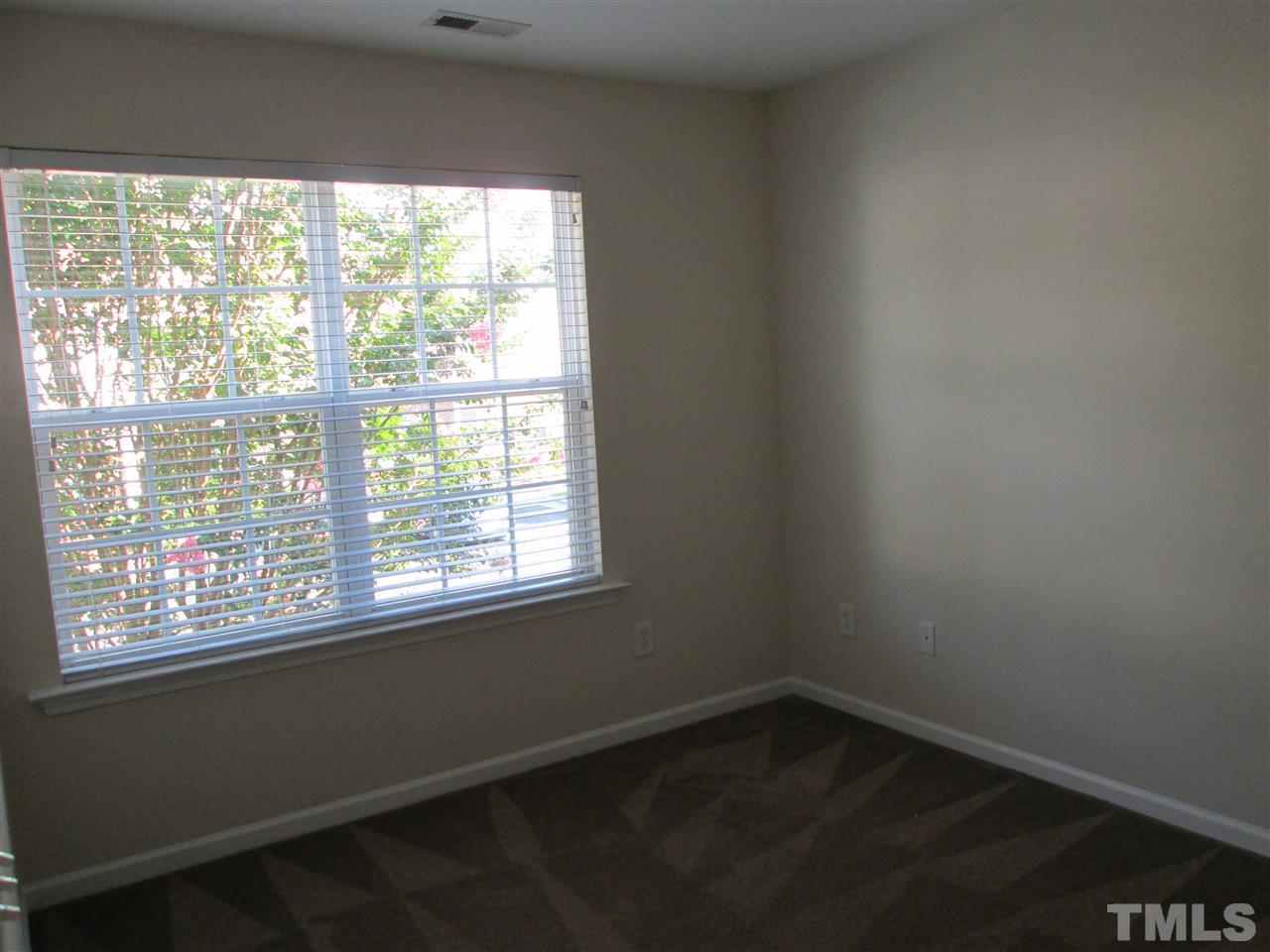 7706 River Field Drive Raleigh, NC 27616 - Photo 20 of 20 a small space with wooden floor and windows
