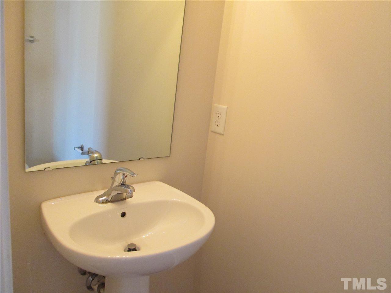 7706 River Field Drive Raleigh, NC 27616 - Photo 10 of 20 a bathroom with a sink and a mirror