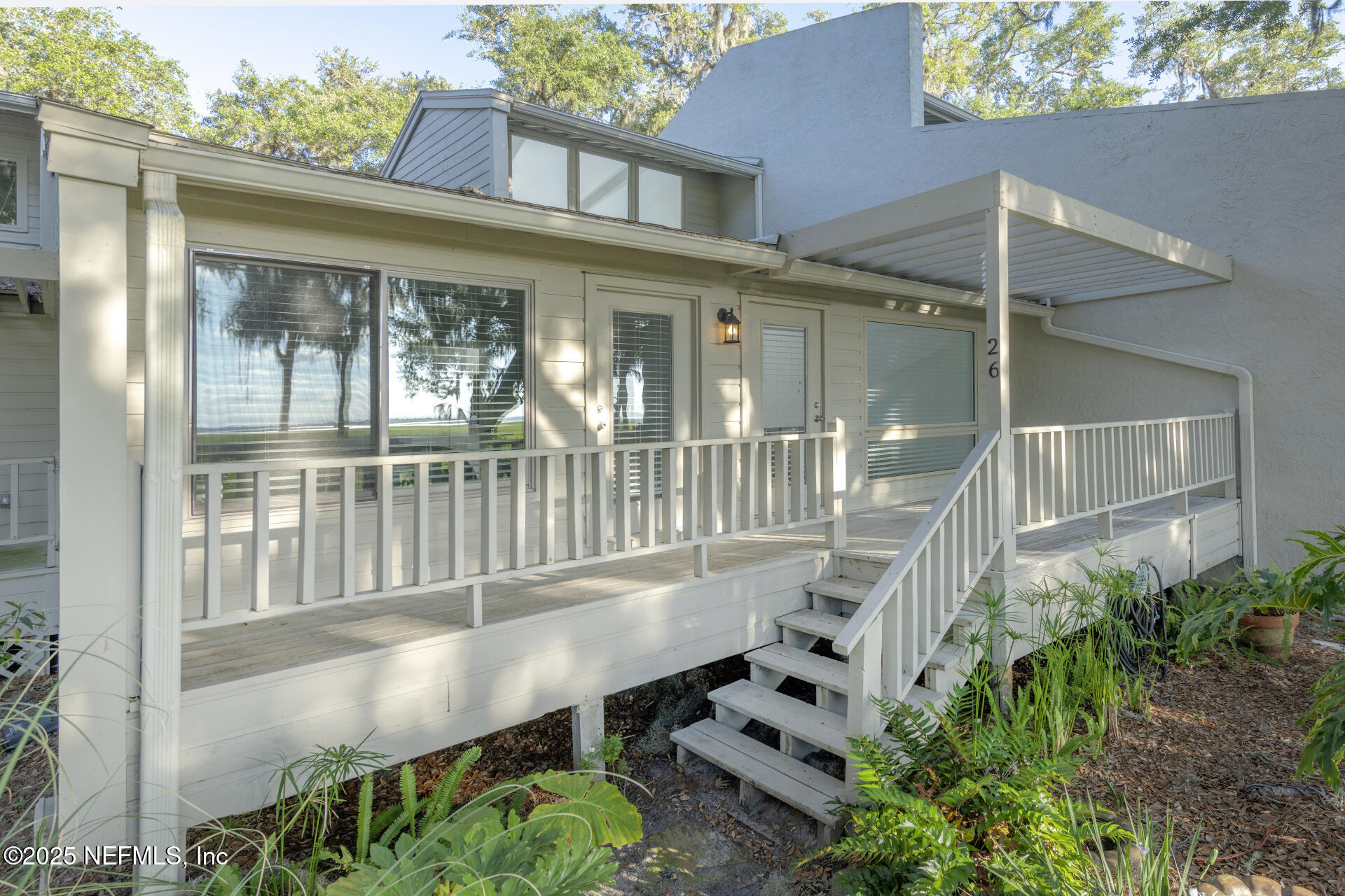 3426 Sea Marsh Road Fernandina Beach, FL 32034 - Photo 27 of 39 a front view of a house with a porch