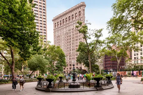 a group of people sitting in front of a building