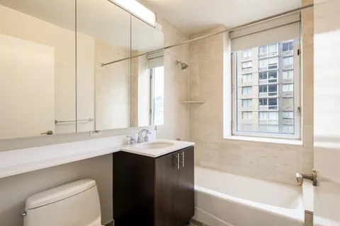 a bathroom with a sink a toilet and a bathtub