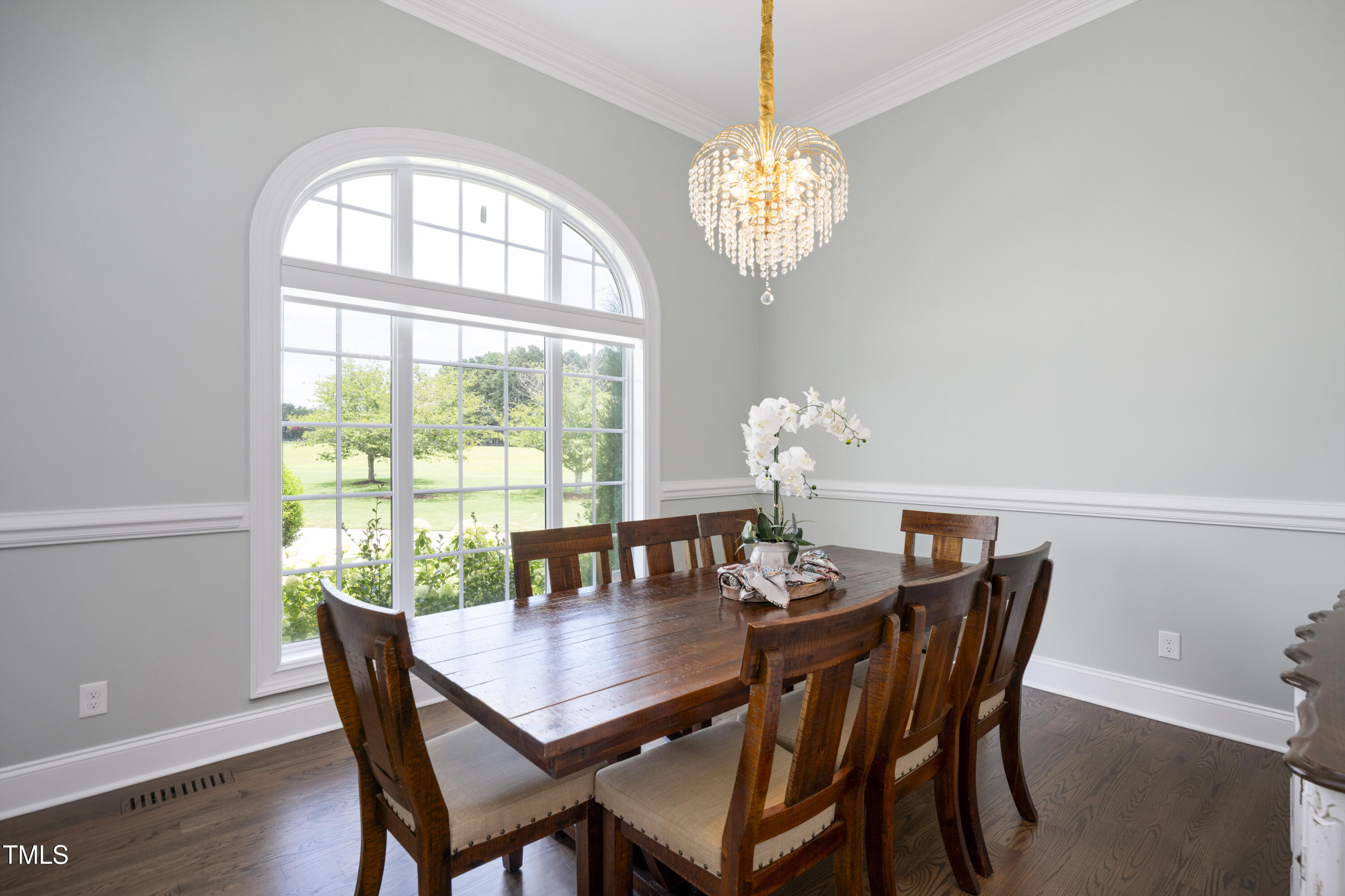 9820 Debnam Road Zebulon, NC 27597 - Photo 11 of 68 a view of a dining room with furniture a chandelier and wooden floor