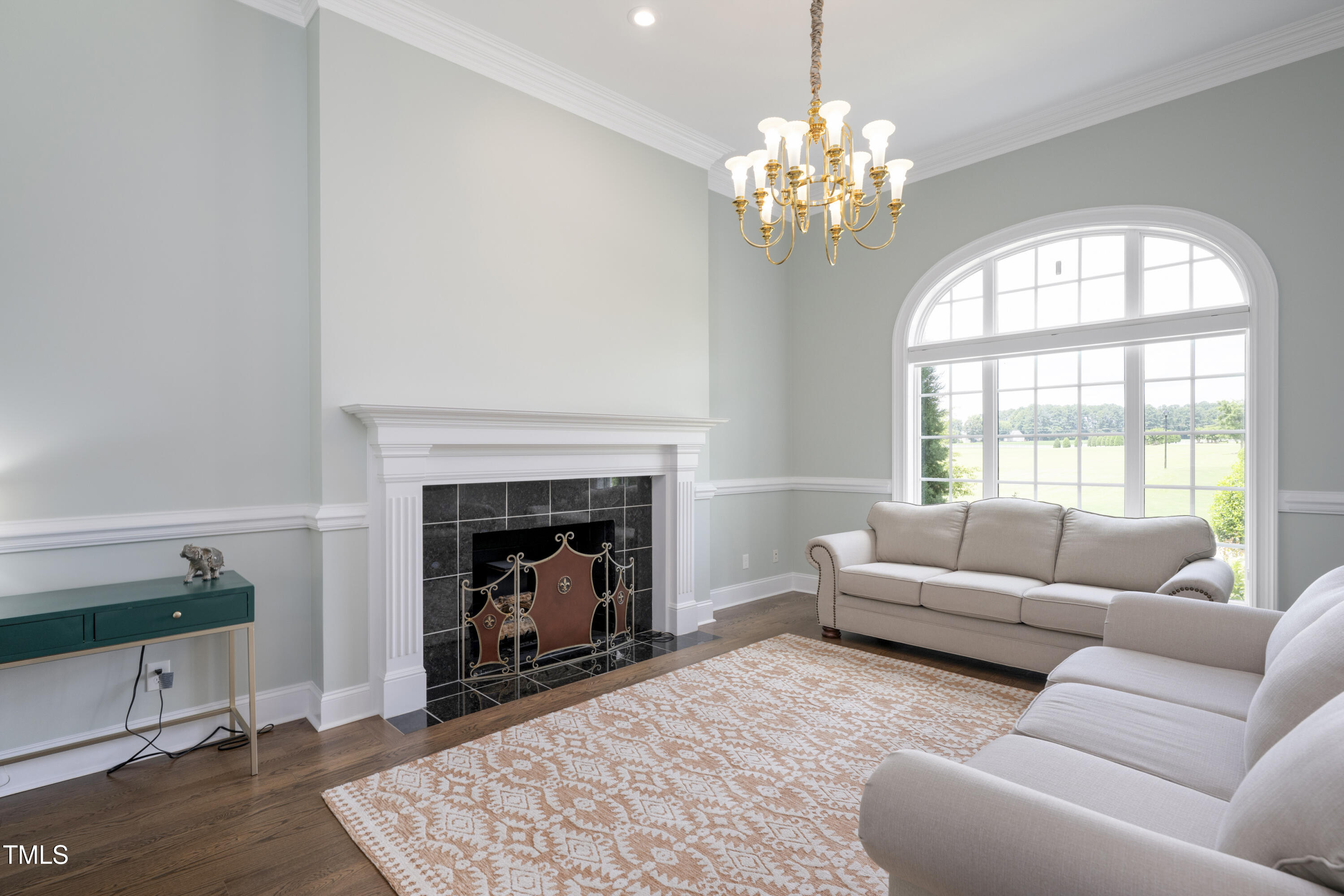 9820 Debnam Road Zebulon, NC 27597 - Photo 14 of 68 a living room with furniture and a fireplace