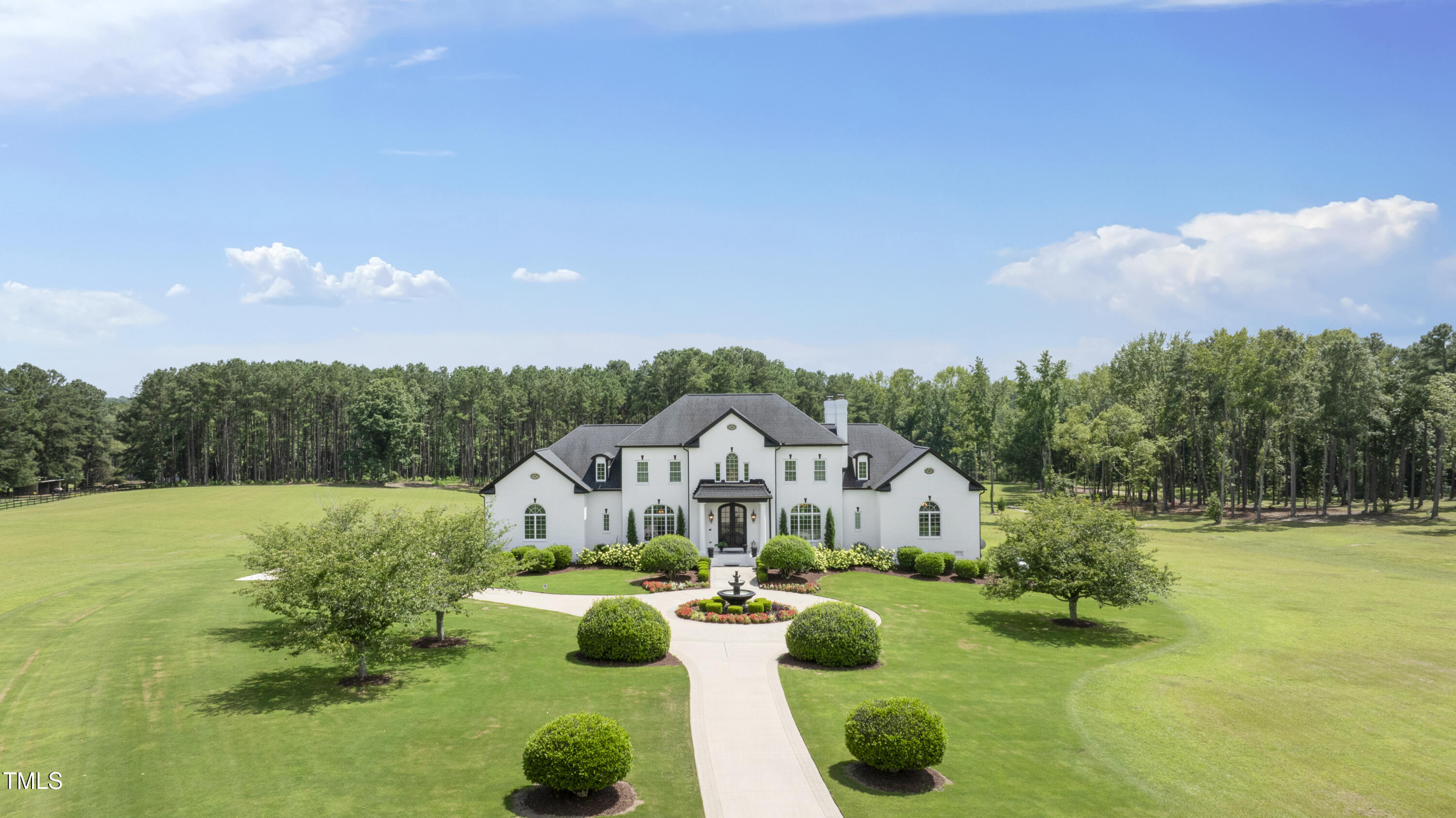 9820 Debnam Road Zebulon, NC 27597 - Photo 2 of 68 a view of house with garden space and street view
