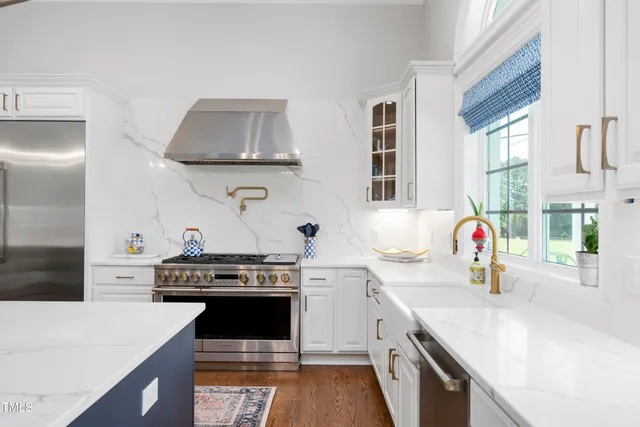 a utility room with sink dryer and washer