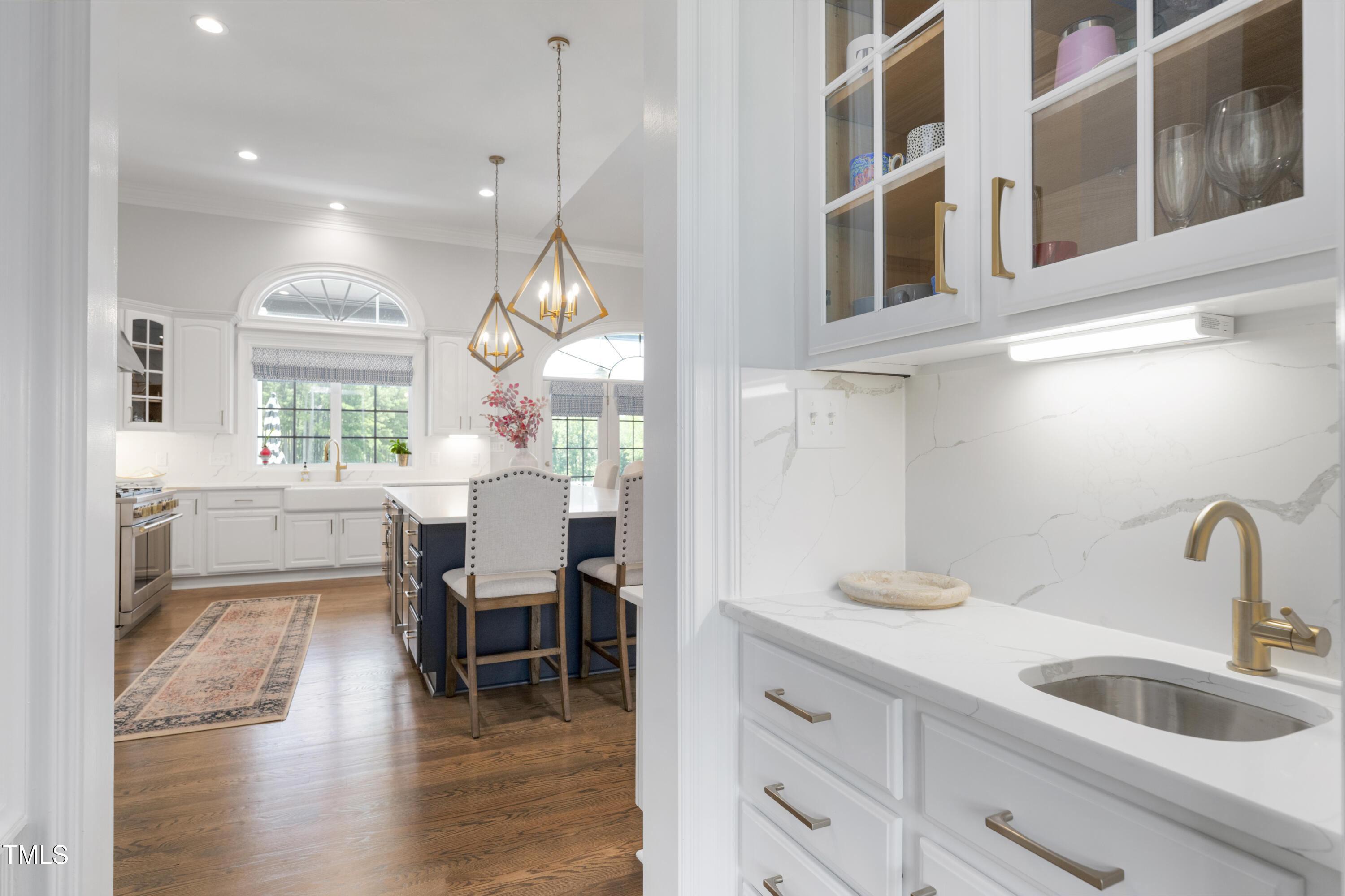 9820 Debnam Road Zebulon, NC 27597 - Photo 23 of 68 a kitchen with cabinets and chairs