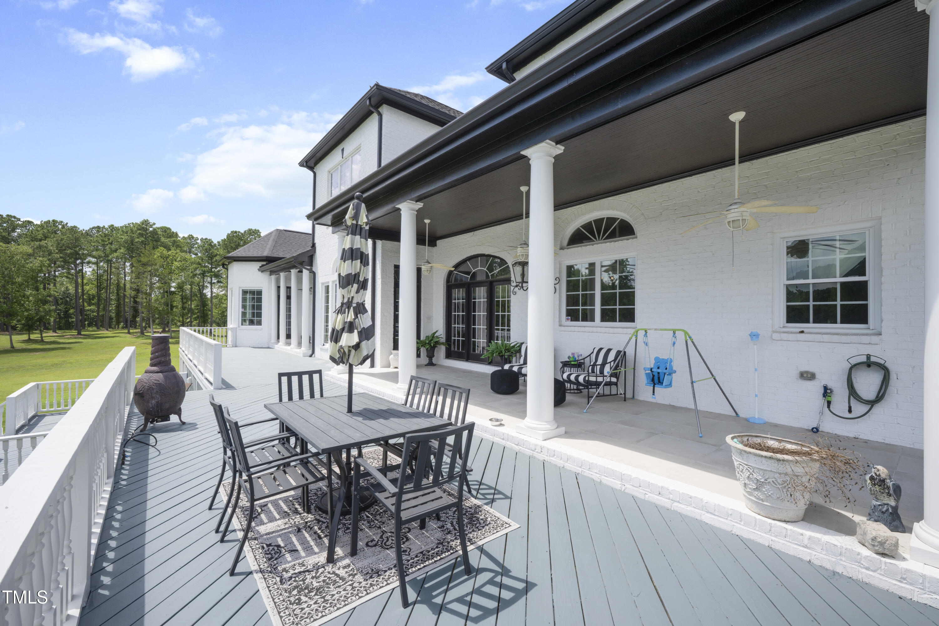 9820 Debnam Road Zebulon, NC 27597 - Photo 27 of 68 a view of a house with backyard porch and sitting area