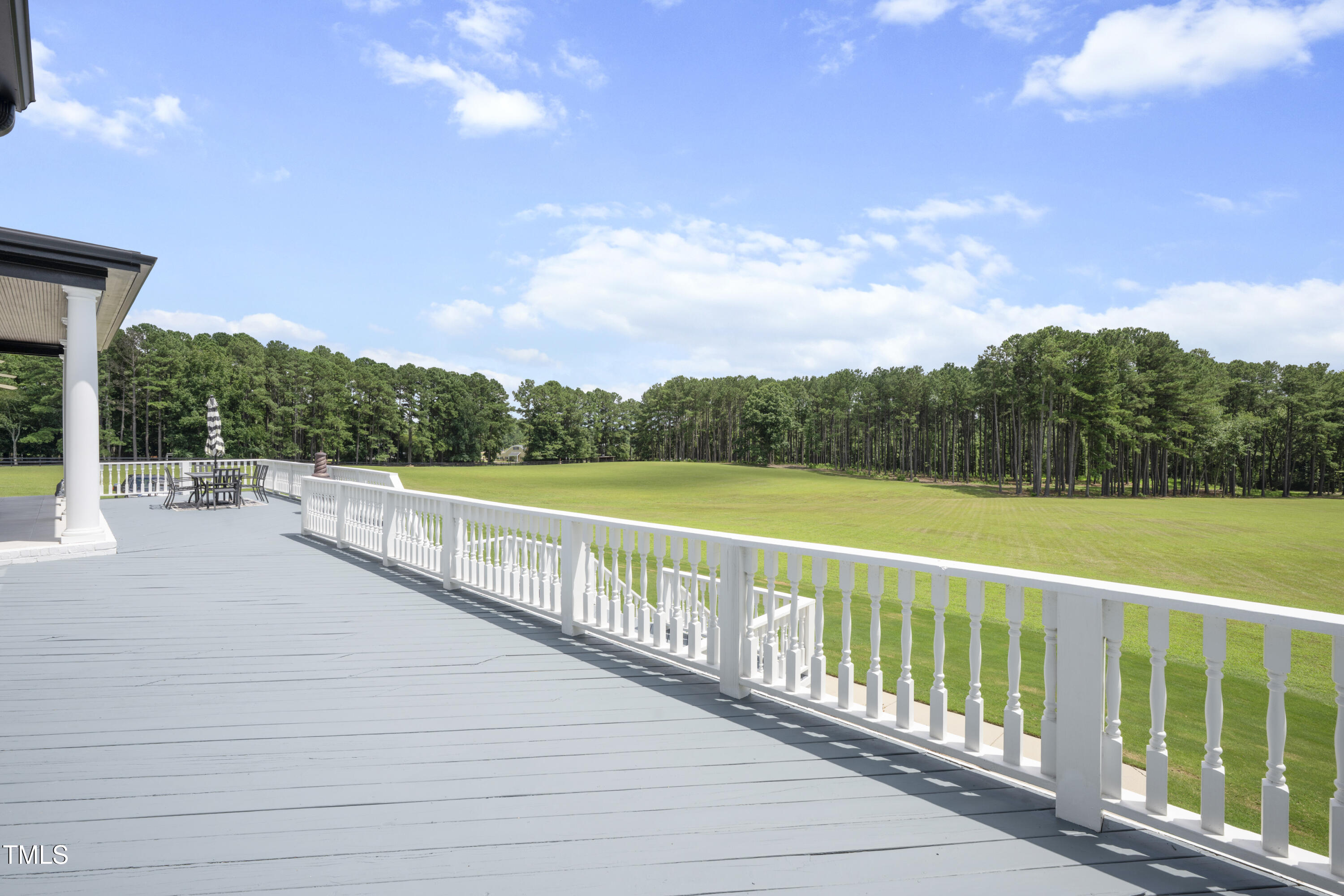 9820 Debnam Road Zebulon, NC 27597 - Photo 28 of 68 a view of outdoor space with deck and yard