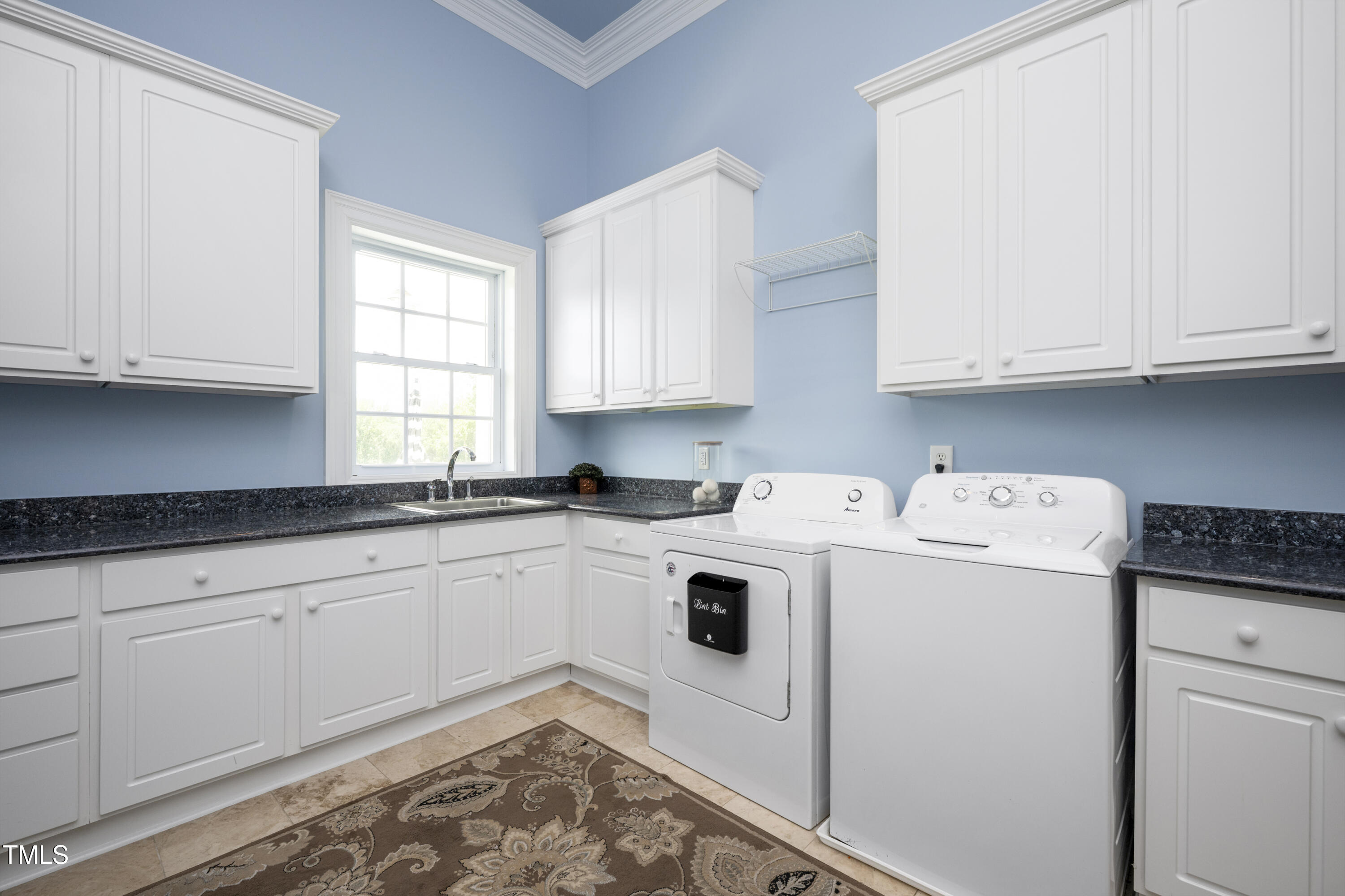 9820 Debnam Road Zebulon, NC 27597 - Photo 29 of 68 a utility room with sink dryer and washer