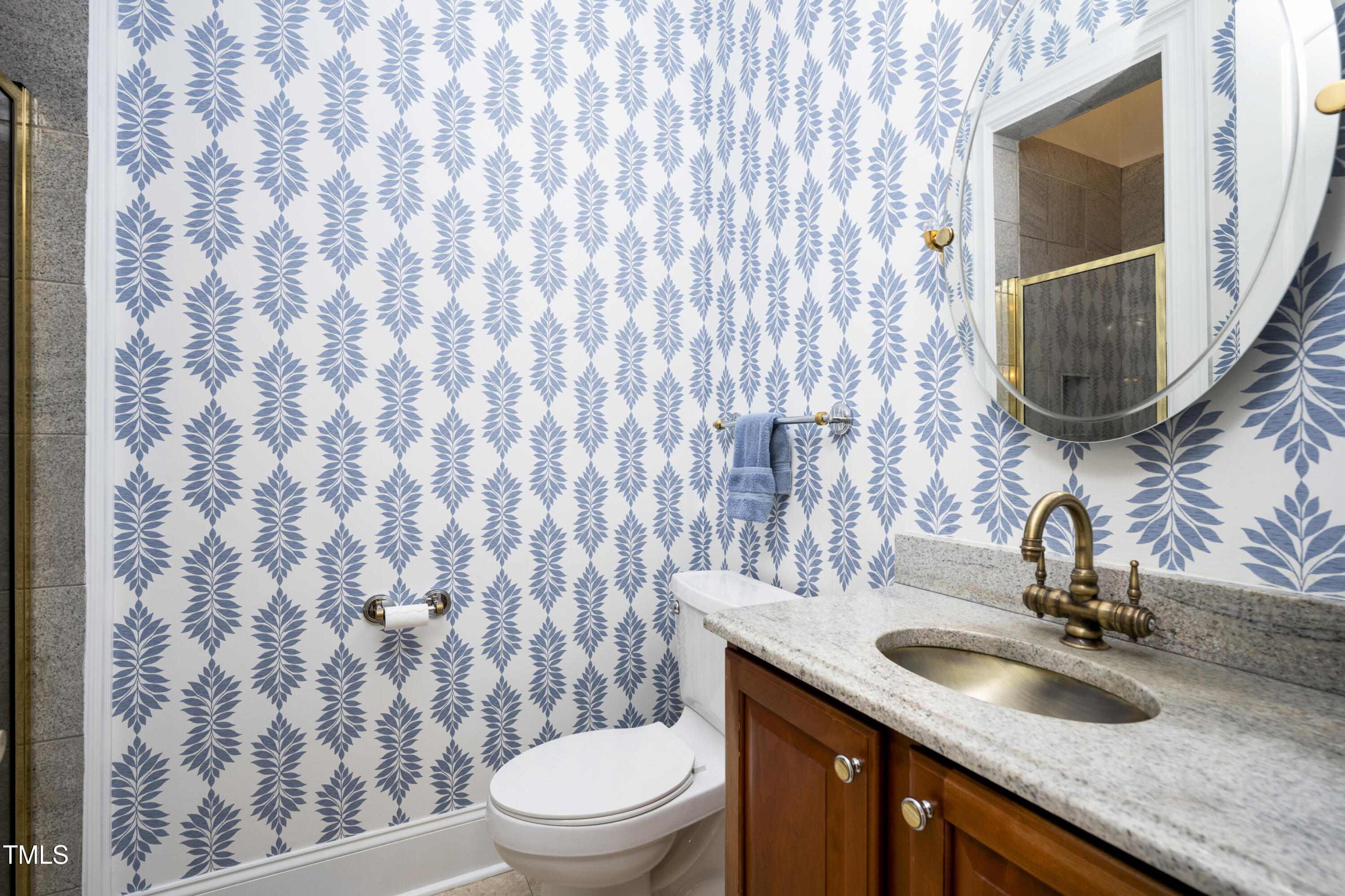 9820 Debnam Road Zebulon, NC 27597 - Photo 30 of 68 a bathroom with a granite countertop sink and a mirror