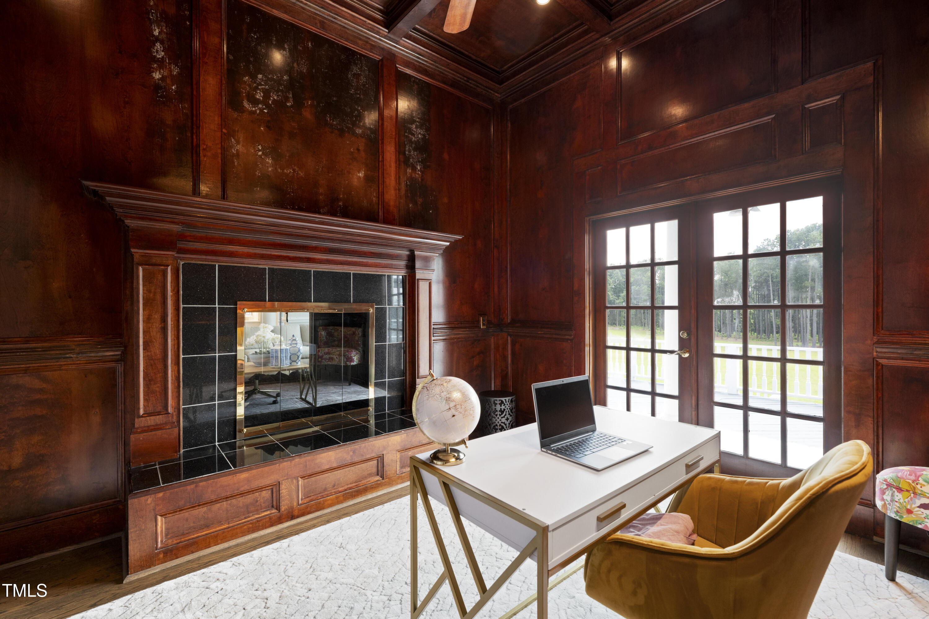9820 Debnam Road Zebulon, NC 27597 - Photo 32 of 68 a living room with furniture a window and a fireplace