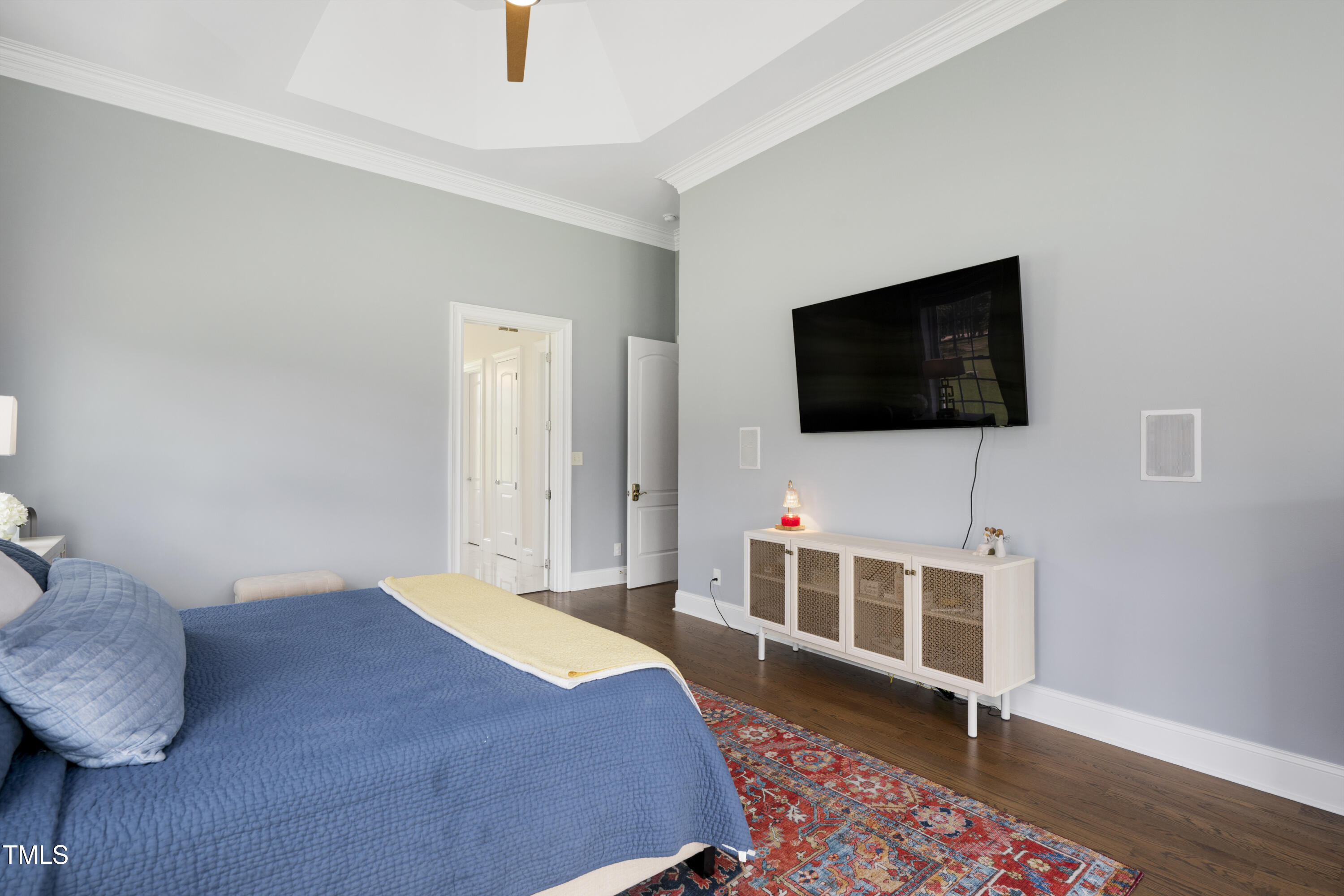 9820 Debnam Road Zebulon, NC 27597 - Photo 34 of 68 a bedroom with a bed and a flat screen tv