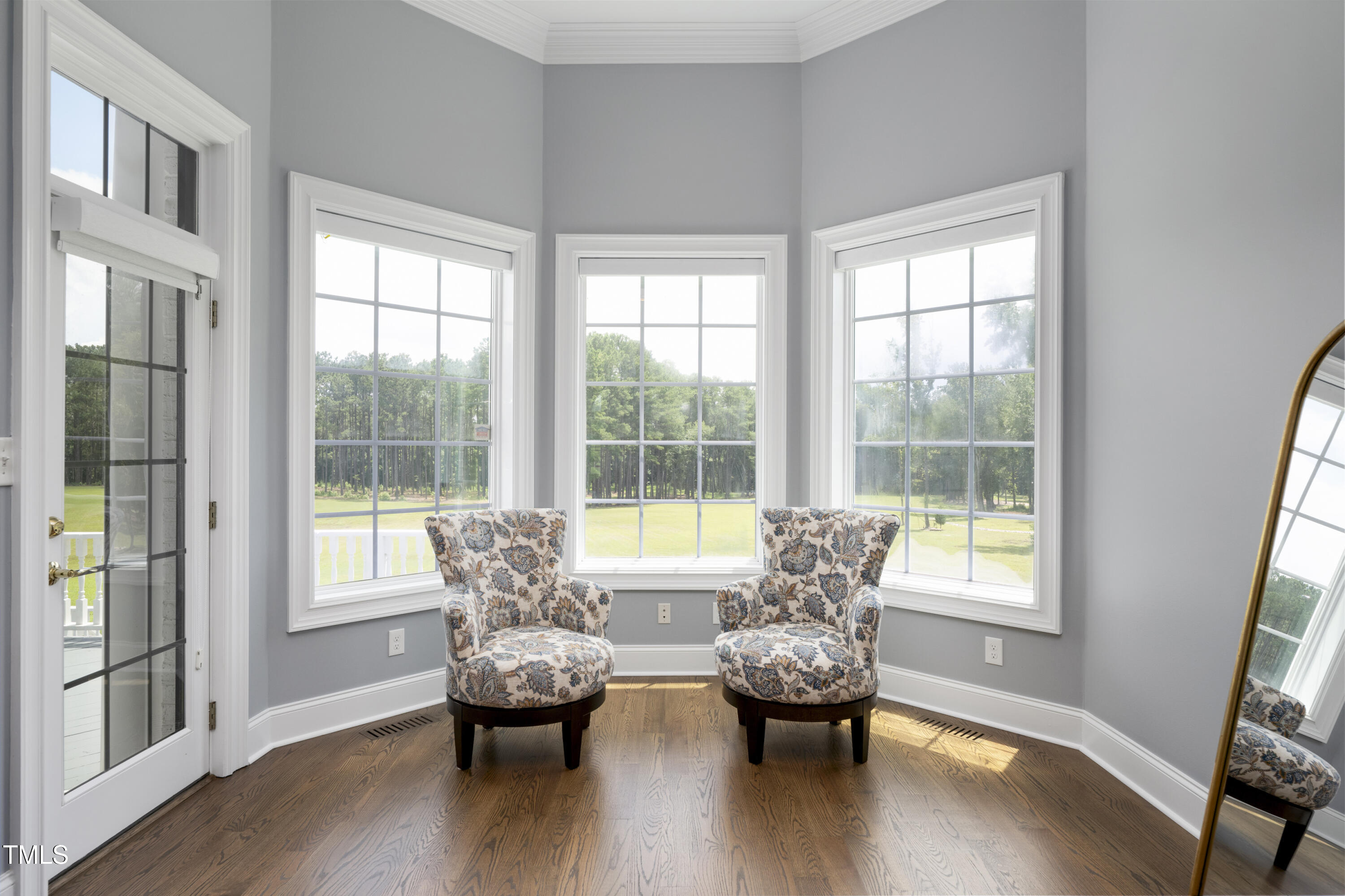 9820 Debnam Road Zebulon, NC 27597 - Photo 35 of 68 a living room with furniture and wooden floor