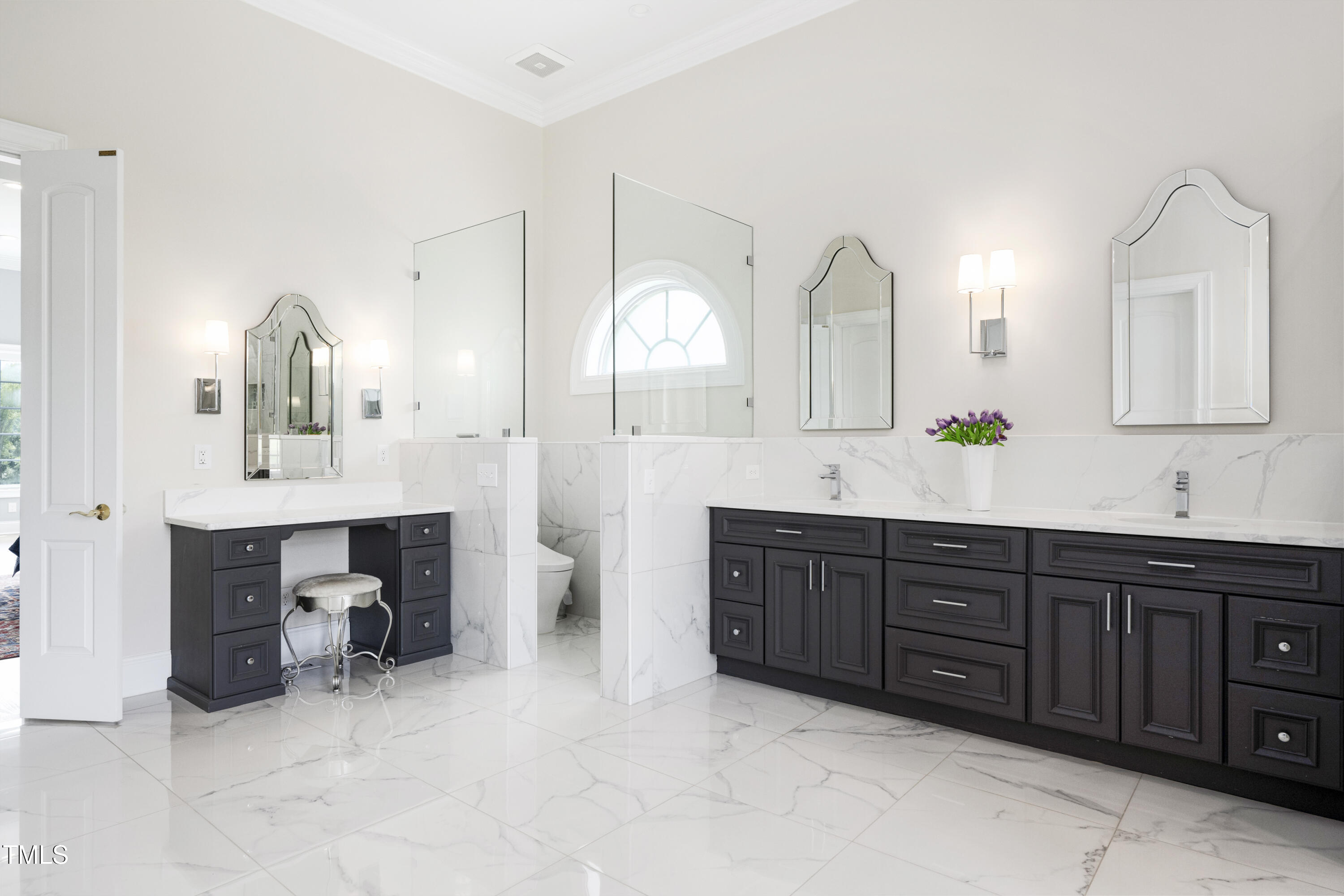 9820 Debnam Road Zebulon, NC 27597 - Photo 38 of 68 a spacious bathroom with a double vanity sink double and a mirror