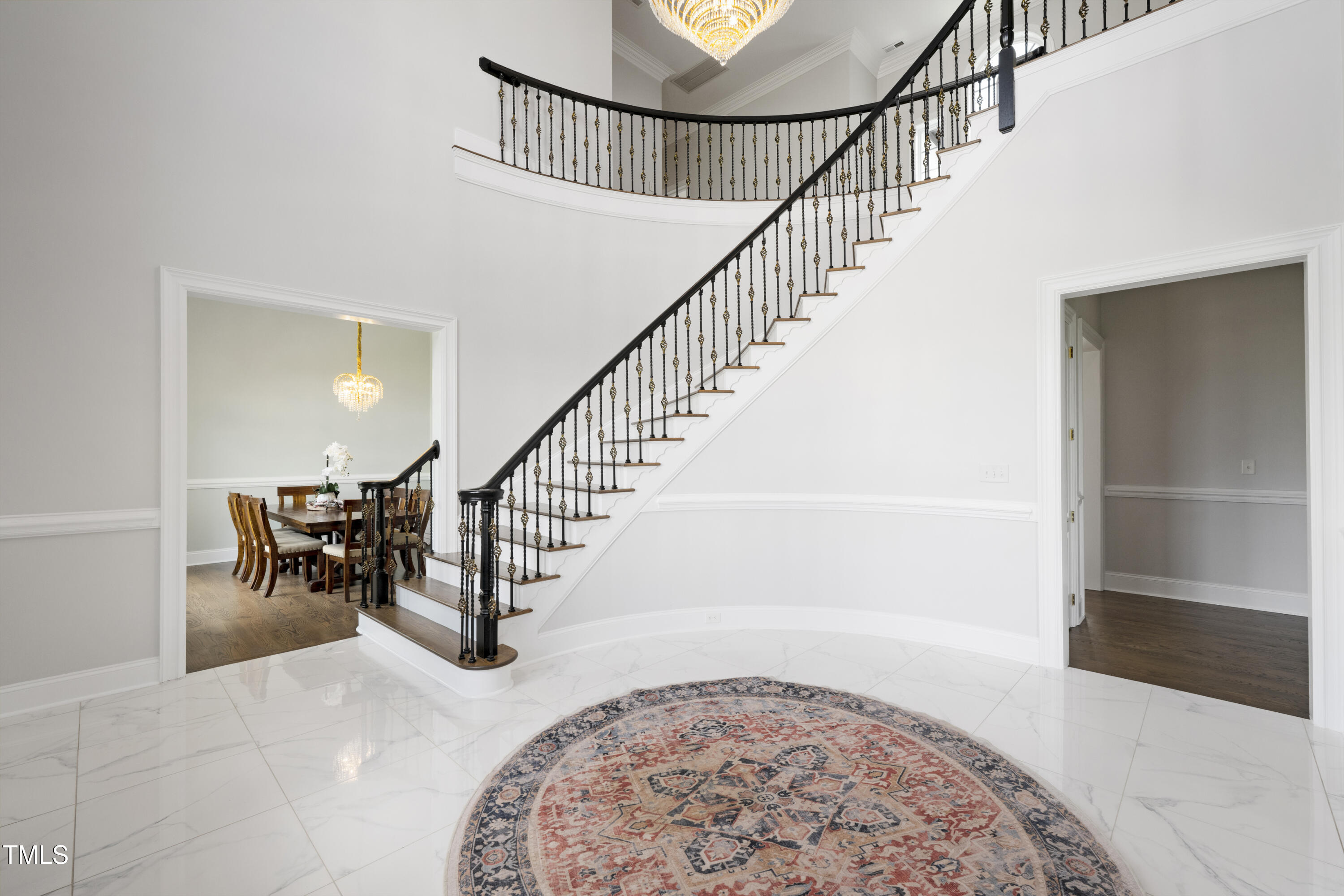 9820 Debnam Road Zebulon, NC 27597 - Photo 40 of 68 a view of entryway and hall with wooden floor