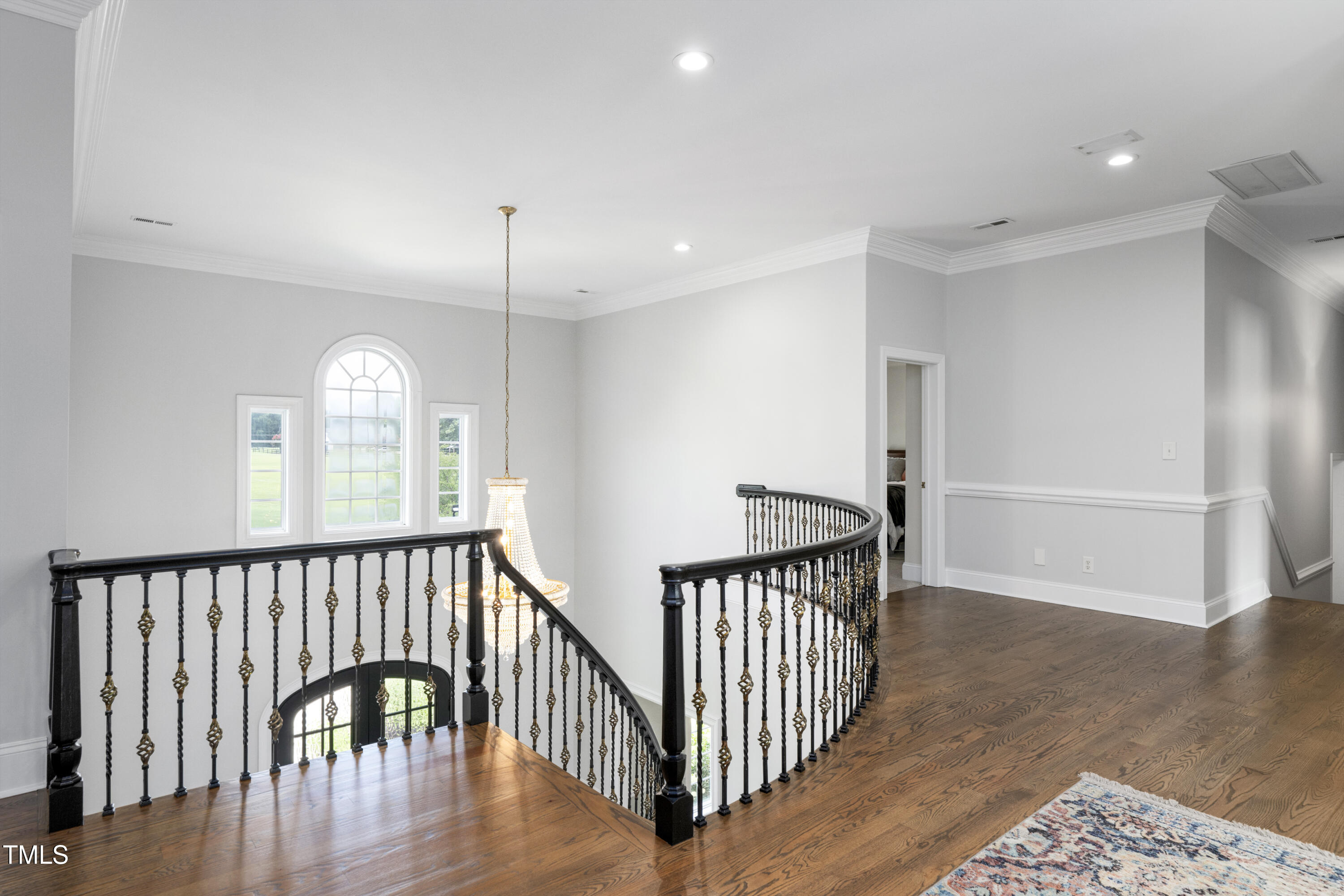 9820 Debnam Road Zebulon, NC 27597 - Photo 41 of 68 a view of a hallway with wooden floor and entryway