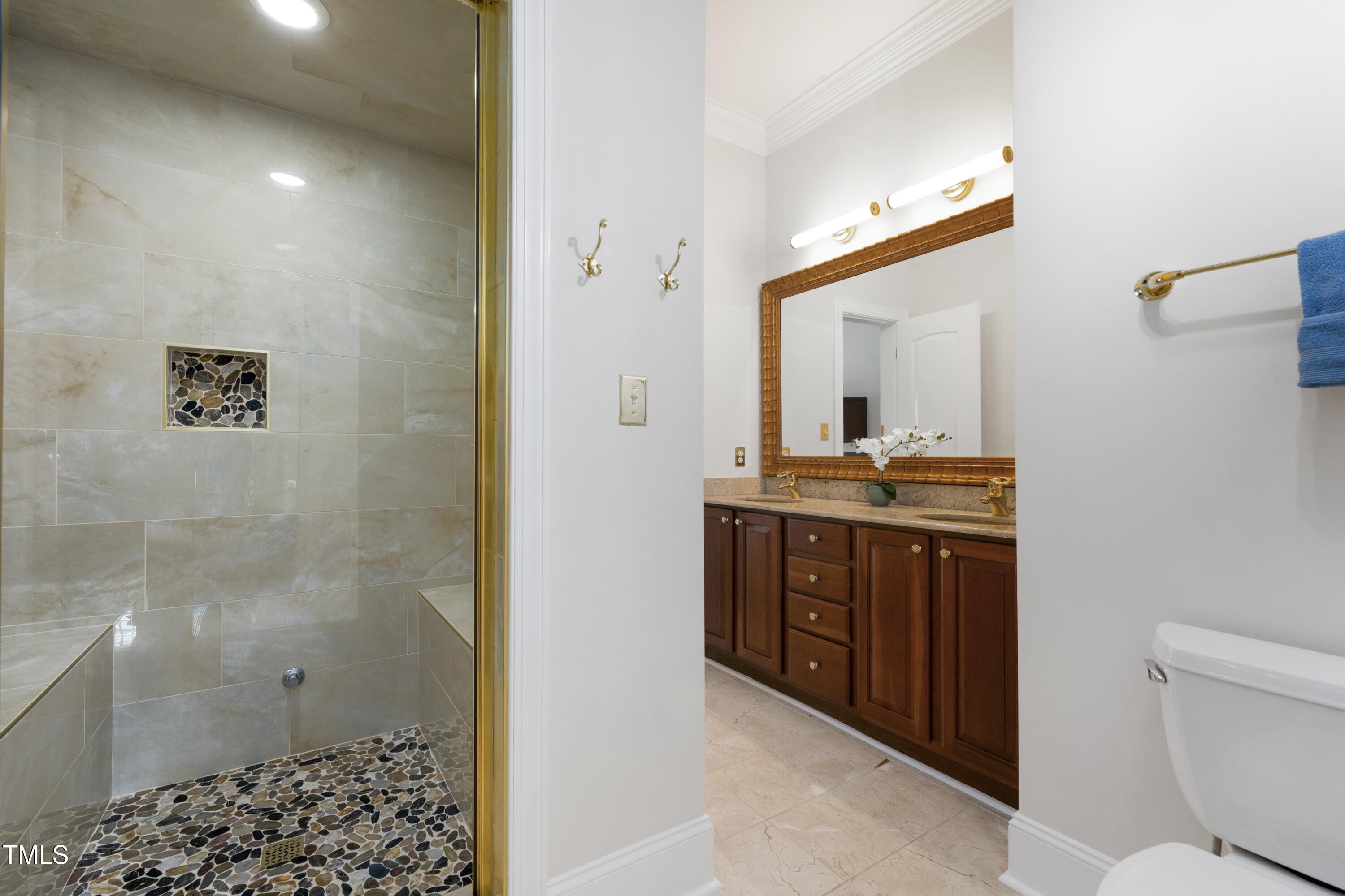9820 Debnam Road Zebulon, NC 27597 - Photo 43 of 68 a bathroom with a sink a toilet and shower