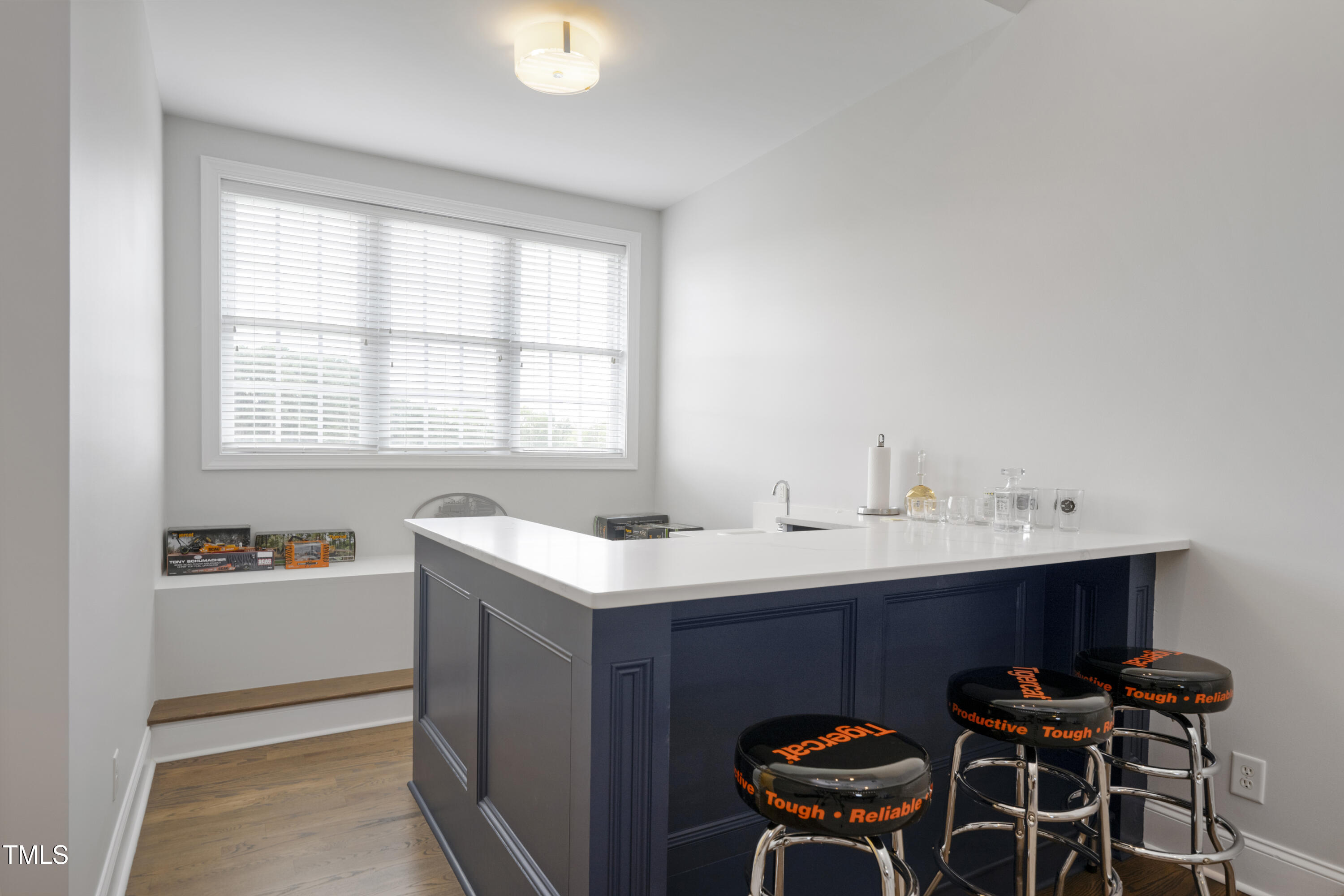 9820 Debnam Road Zebulon, NC 27597 - Photo 52 of 68 a view of a kitchen area with a sink and chairs