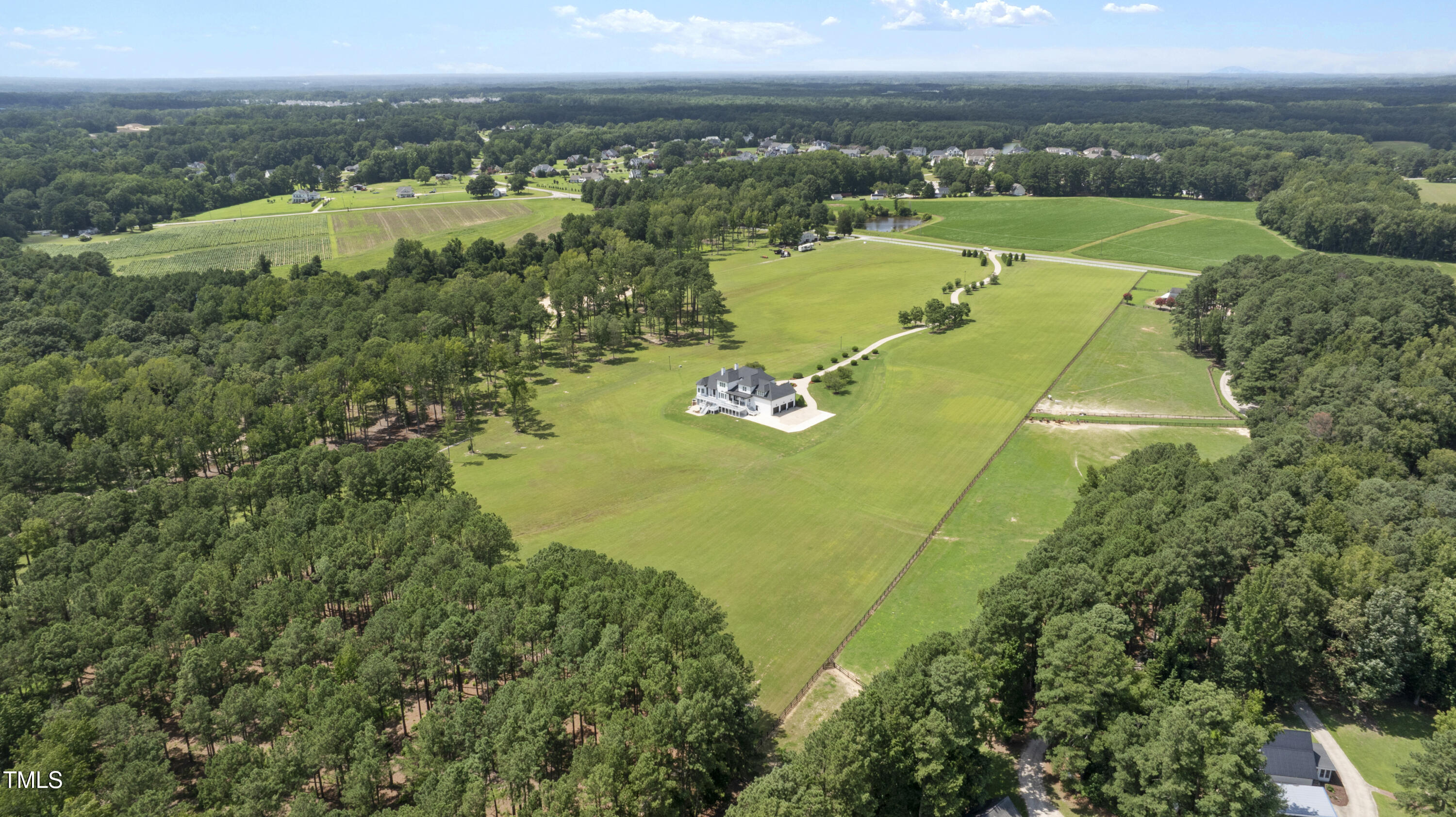 9820 Debnam Road Zebulon, NC 27597 - Photo 63 of 68 an aerial view of a residential houses with outdoor space and trees all around