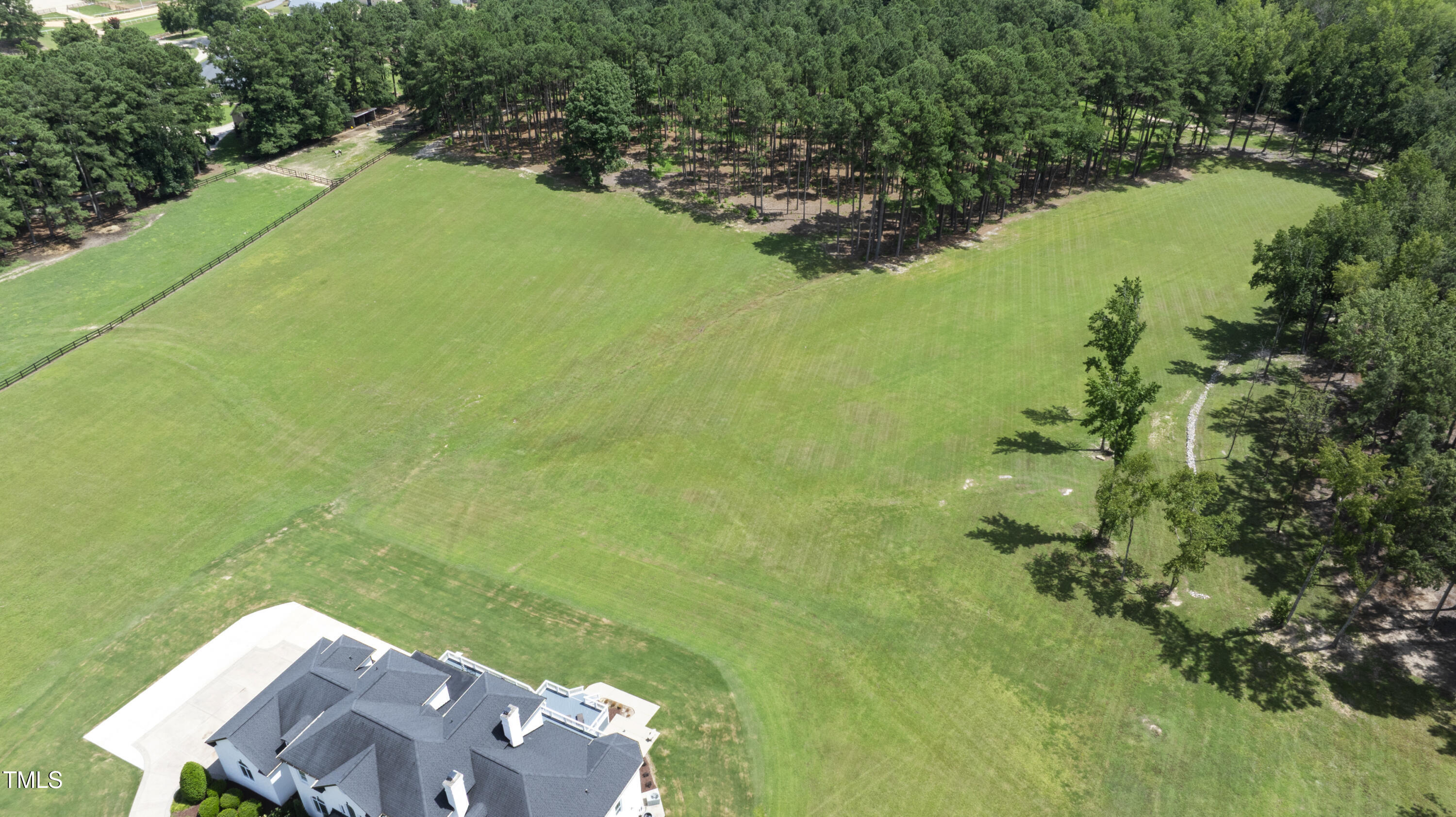 9820 Debnam Road Zebulon, NC 27597 - Photo 65 of 68 an aerial view of a house with a yard