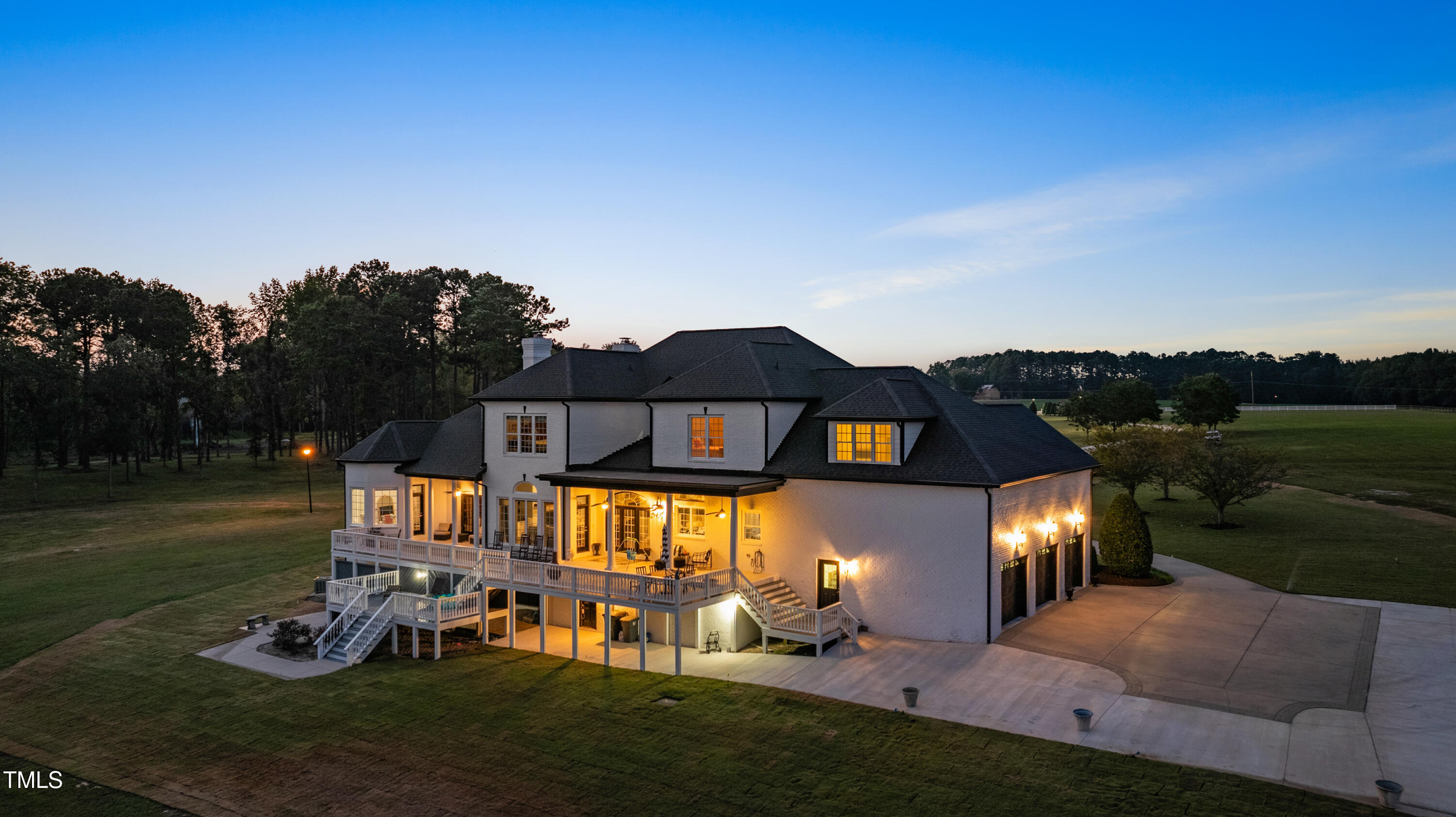 9820 Debnam Road Zebulon, NC 27597 - Photo 9 of 68 a front view of a house with garden and patio
