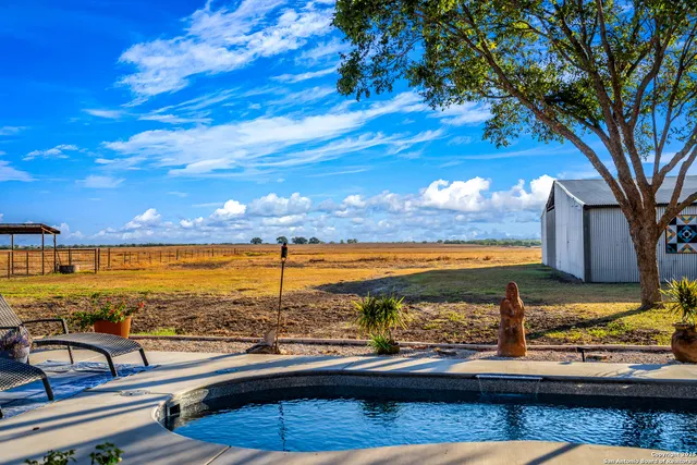 a front view of a building with outdoor seating