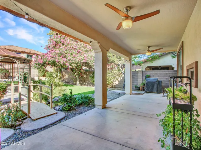 a front view of a house with a yard table and chairs