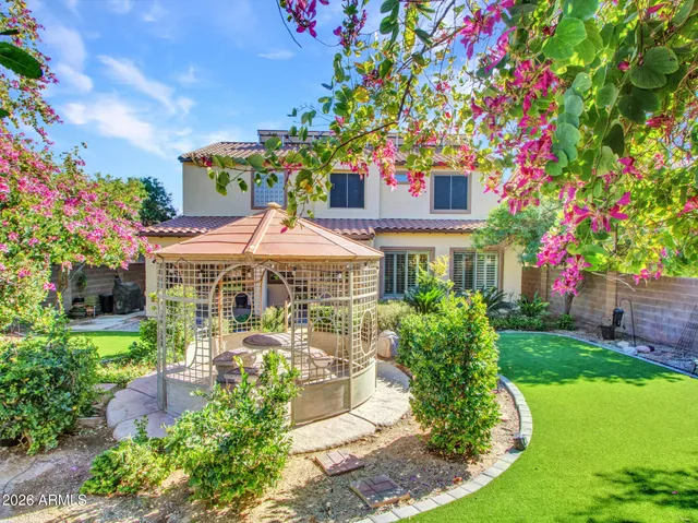 a view of a dining room with furniture large windows and wooden floor