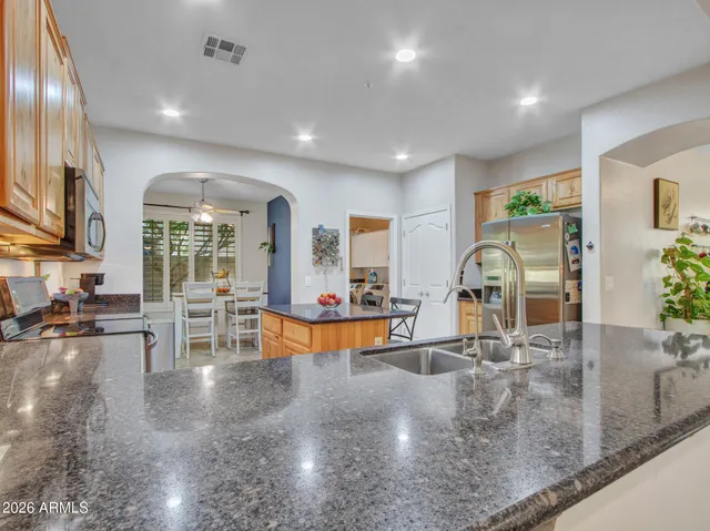 a spacious bathroom with double vanity a mirror a bathtub and a shower