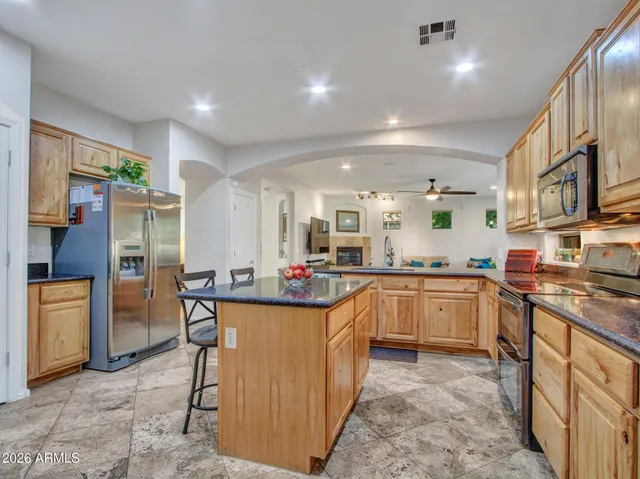 a view of walk in closet with clothes