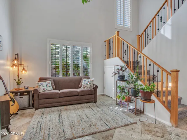 a view of living room with furniture and wooden floor