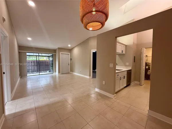 a view of a kitchen with a sink and a window