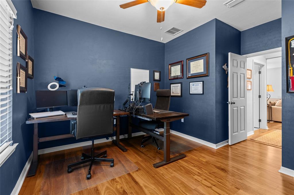 8251 Southwest 78th Lane Gainesville, FL 32608 - Photo 14 of 29 a view of a workspace with furniture and a window