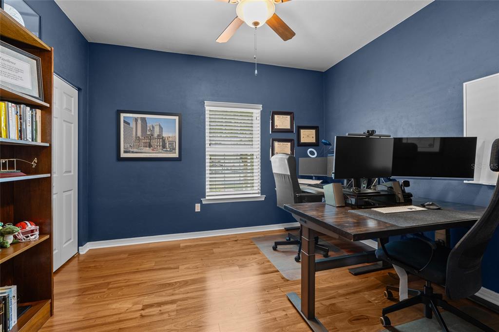 8251 Southwest 78th Lane Gainesville, FL 32608 - Photo 15 of 29 a workspace with furniture and bookshelf