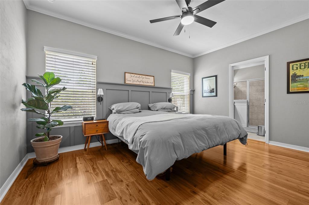 8251 Southwest 78th Lane Gainesville, FL 32608 - Photo 16 of 29 a bedroom with a bed and a potted plant