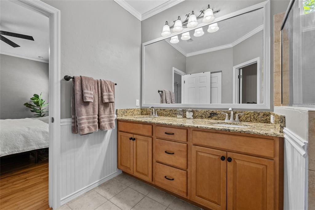 8251 Southwest 78th Lane Gainesville, FL 32608 - Photo 20 of 29 a bathroom with a sink double vanity and a mirror